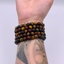 Load and play video in Gallery viewer, Blue/Gold/Red Tigers Eye Bracelet
